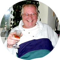 Picture of Lee Simms, 2005 holding a glass of wine